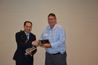 Don Poon receiving the 2016 Engineer of the Year award from outgoing President Doug Drever